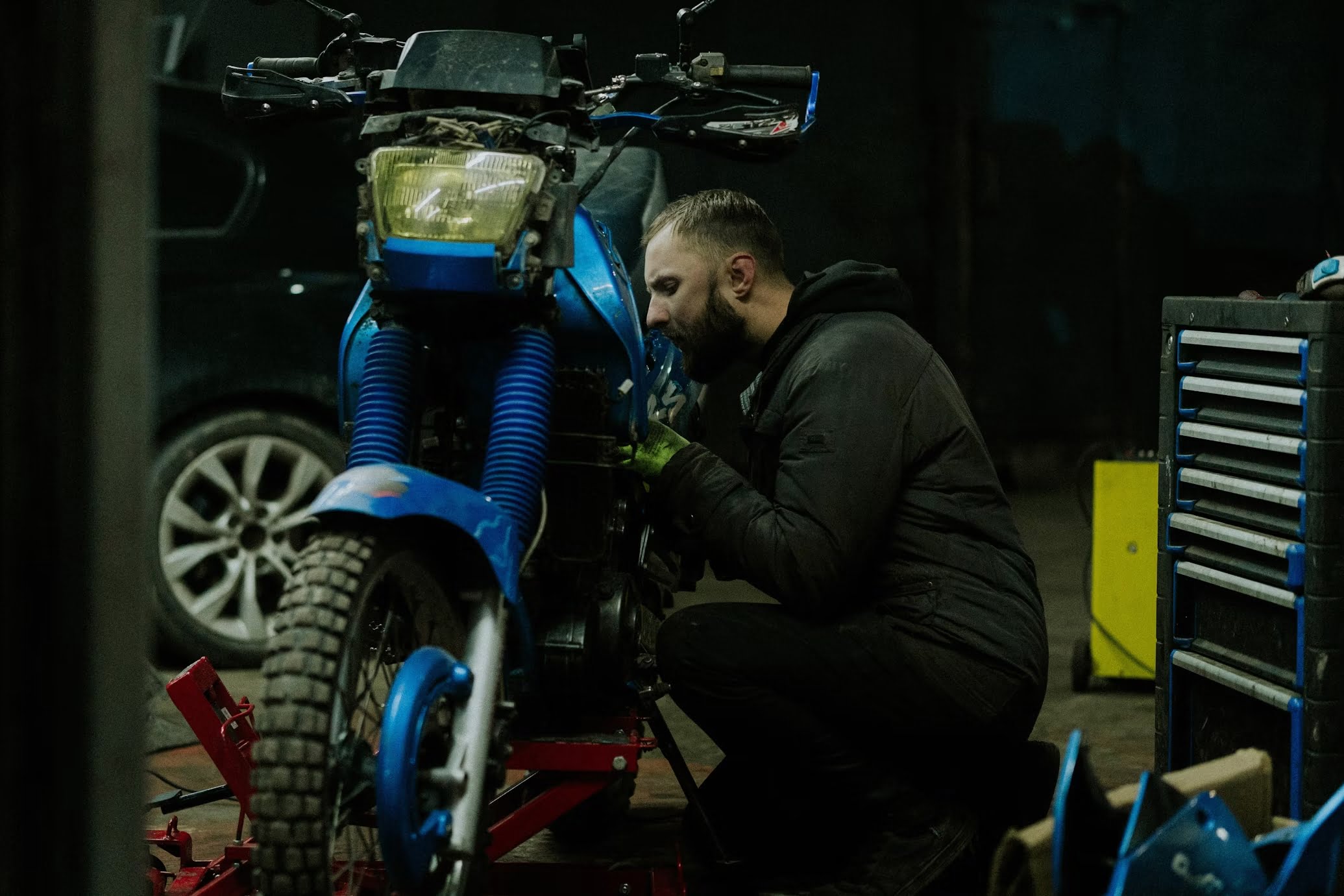 Man repairing motorcycle